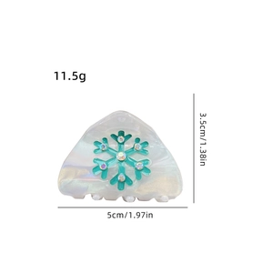 Triangle hair claw with turquoise snowflake and rhinestones in pearly white finish