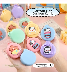 Detail of cute cartoon foldable hairbrush with compact mirror and 3D bear ornaments