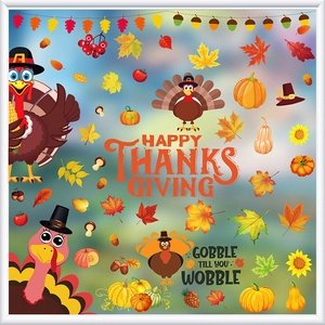 Detail of Thanksgiving window clings with festive turkey, pumpkin and fall leaf patterns