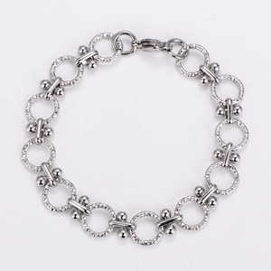 Close-up of punk stainless steel O-chain bracelet with textured rings and lobster clasp