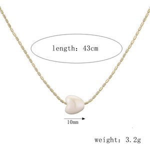 Golden ceramic heart pendant necklace with 43cm chain and 10mm charm detailing