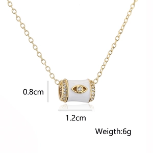 Detail shot of 18K gold-plated enamel pendant with evil eye motif and 6g weight spec