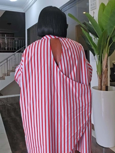 Detailed back view of red striped shirt featuring a triangle cutout design on the back