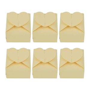 Set of six beige pearl paper heart-shaped wedding candy boxes in a neat grid display