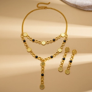 Vintage gold layered necklace set with round embossed pendants and black bead accents