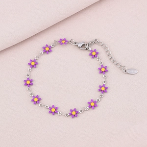 Detail of silver stainless steel bracelet featuring purple enamel daisy petals and lobster clasp
