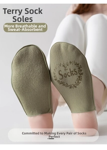 Detail view of military green cotton socks with thick cushioned terry soles for comfort