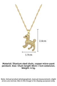 Detailed specs of gold poodle pendant necklace featuring clear crystals and steel chain