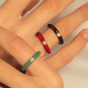 Colorful enamel rings with round zircon in forest green, red, and dark coffee tones