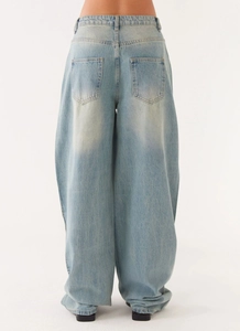 Back view of high-waist light blue wide-leg denim jeans with dual rear pockets