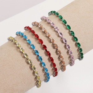 Detail of colorful marquise-cut zircon tennis bracelets on a soft cylindrical display stand