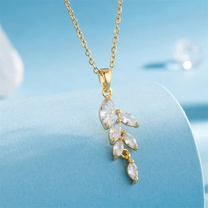 18K gold plated wheat ear pendant necklace with marquise zircons on blue backdrop