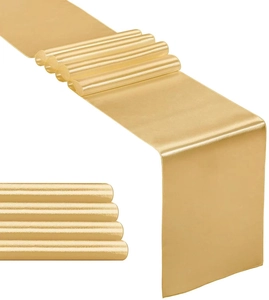 Macro shot of smooth gold satin table runners with glossy polyester texture and neat folds