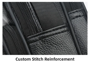 Detail view of leather bag showing reinforced stitching and multi-zipper compartments