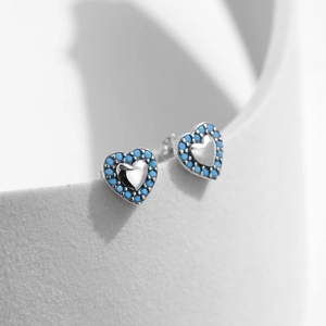 S925 sterling silver heart stud earrings with vintage turquoise beaded rim on white stand