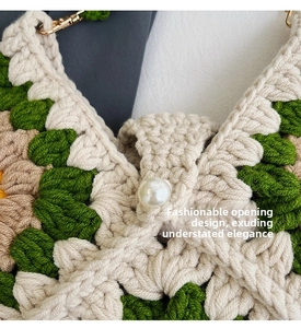 Detail of sunflower crochet bag with white pearl button closure and green knit texture