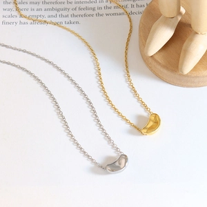 Chic 18K gold plated titanium steel lucky bean pendant necklace in gold and silver finish