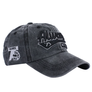 Detailed embroidery of Always '75 on a charcoal grey washed cotton baseball cap
