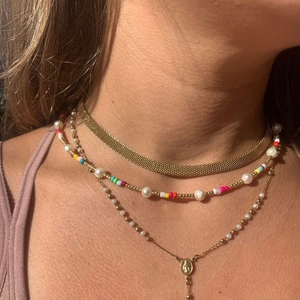 Three-layer layered necklace set with colorful pearls and gold religious pendant