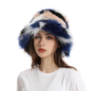 Detail of multi-color faux fur bucket hat with plush texture on female model