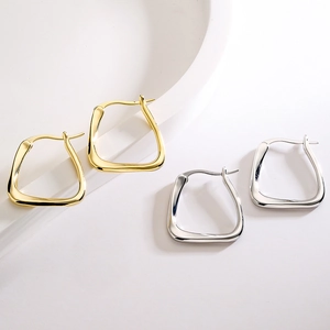 Minimalist geometric square earrings in gold and silver finish on a clean white display