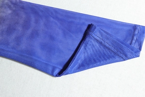 Detailed close-up of blue mesh fabric texture and high-quality sewing craftsmanship edges