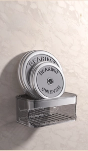 Strong suction double layer grey soap holder demonstrating weight capacity on marble wall