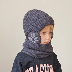 Kids winter knit hat and scarf set with purple snowflake pattern and ear protection
