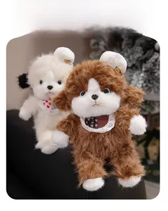 Close-up of soft plush puppy toys in brown and white with lace floral bib details