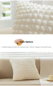 Detailed macro view of cream popcorn fabric texture and 3D puffy square cushion cover