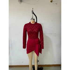 Red long sleeve dress with floral lace top and side bow detail on pleated skirt