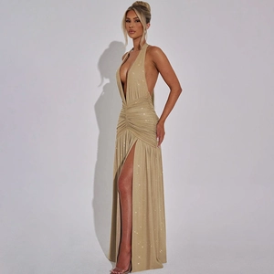 Detail of elegant gold sparkling V-neck dress featuring a high side slit and ruched texture