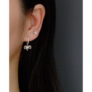 Detail view of S925 sterling silver fan-shaped earrings with goat head charms and diamonds