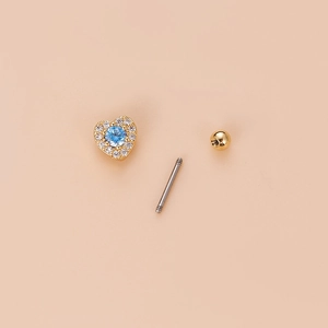 Gold heart screw back stud earring with blue zircon stone and clear accent crystals