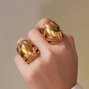 Polished 18k PVD gold plated chunky titanium steel statement ring with cutout detailing