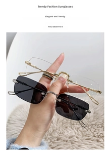 Detail of rimless rectangular eyewear with textured metal temples in gold and silver colors