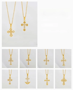 Detailed close-up of titanium steel cross pendants with micro-inlaid zircon stones
