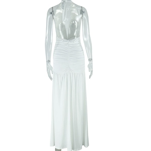 Detail of white backless halter dress with ruched seam and floor-length draping