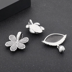 Three-piece vintage silver steel pendant set featuring turtle, flower and evil eye designs