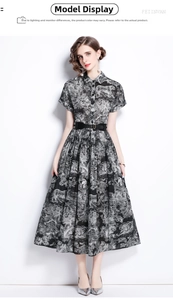 Detail of vintage black and white animal print shirt dress with fine forest pattern