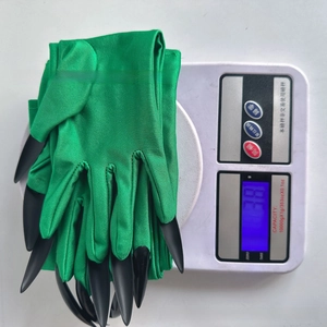 Detailed view of green claw gloves for Halloween costume weighing approximately 38g