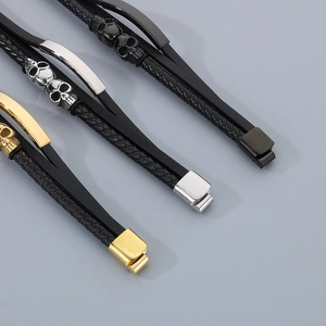 Detailed top view of multi-layer leather bracelets with skull charms and magnetic clasps