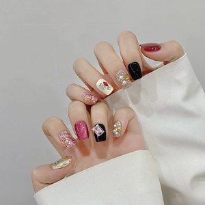Handmade press-on cat eye nails with dark black, pink glitter, pearls and rhinestones