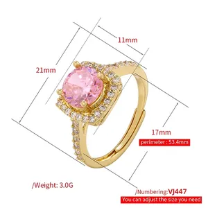 Golden adjustable open ring with large round pink gemstone and sparkling side pavé diamonds