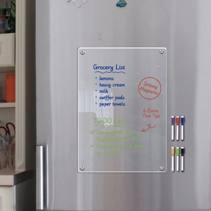 Magnetic acrylic weekly calendar board with 6 markers on a silver refrigerator