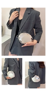 Detailed views of a silver mirror-finish egg-shaped crossbody bag with a metal chain