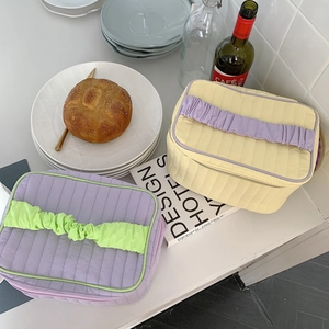 Quilted large capacity makeup bag with ruffle handle in lilac and pastel yellow