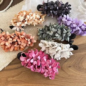 Elegant fabric flower hair clips in Morandi colors including pink, white, and orange