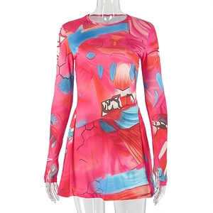 Detail view of the colorful abstract print dress featuring thumbhole cuffs and crew neck