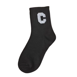 Classic black cotton crew socks with white letter C pattern on a clean white background